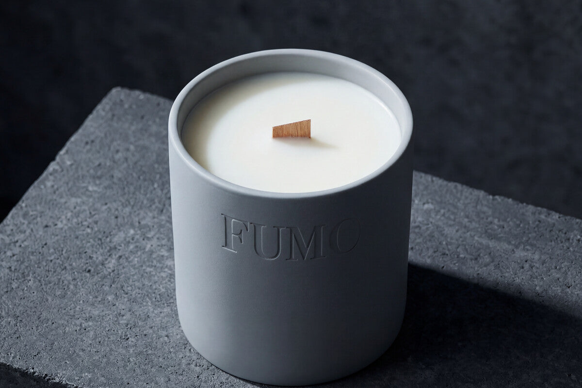 FUMO wood wick close-up in cream-colored candle wax