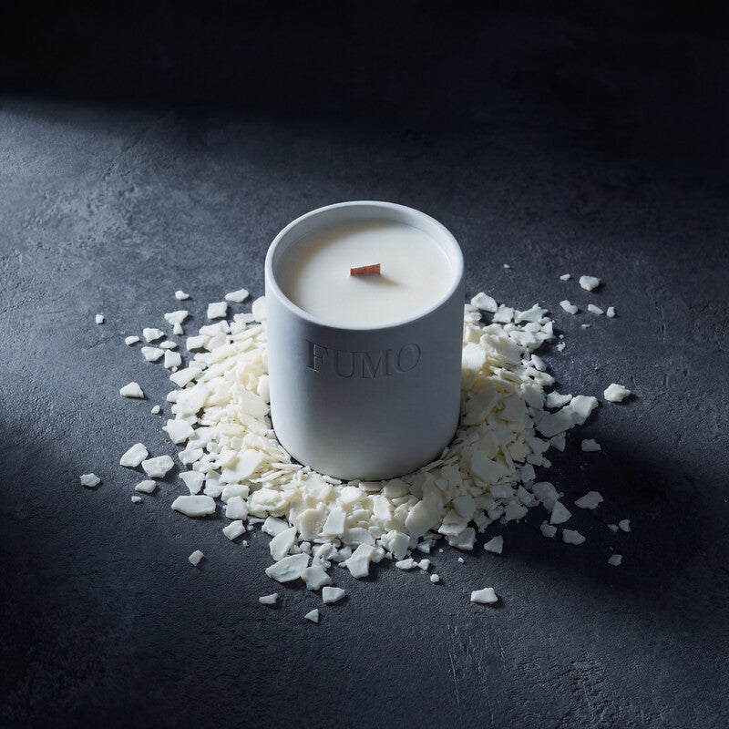 FUMO soy wax flakes on stone surface